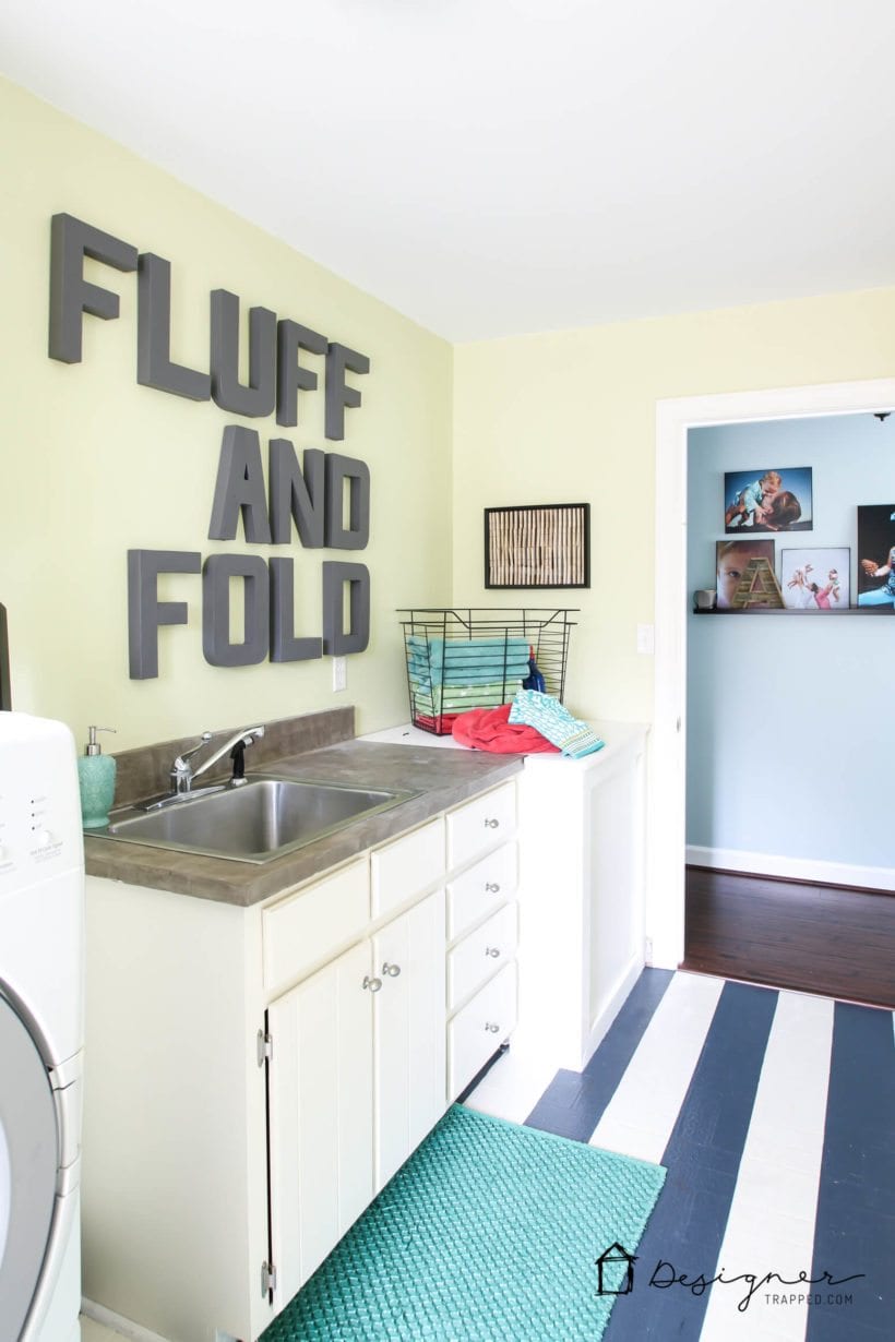 affordable laundry room makeover with painted vinyl floor