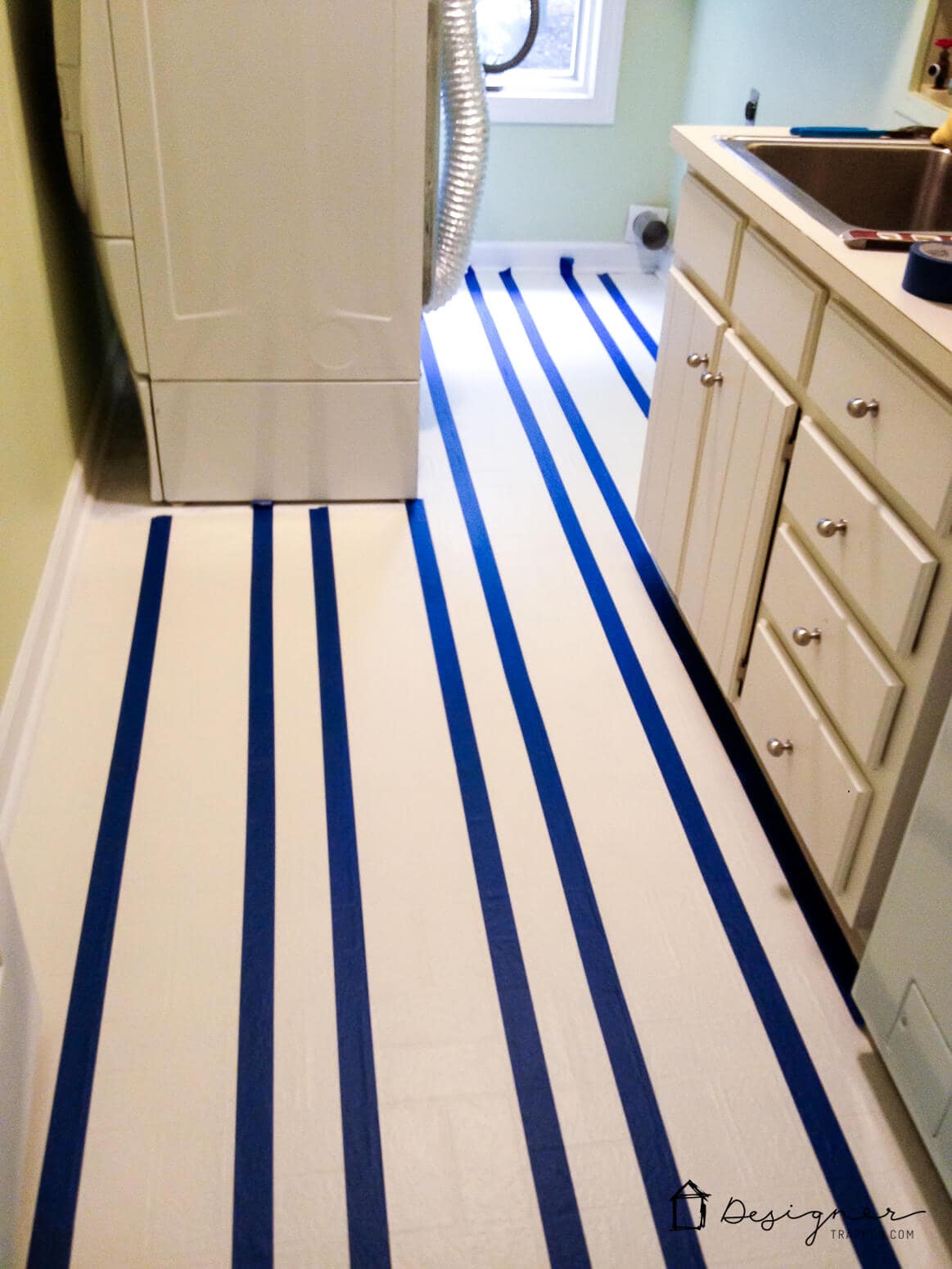 You don't have to live with old, outdated vinyl floors! You can learn how to paint vinyl floors in a way that will last for YEARS with this step-by-step tutorial. Click to read it!