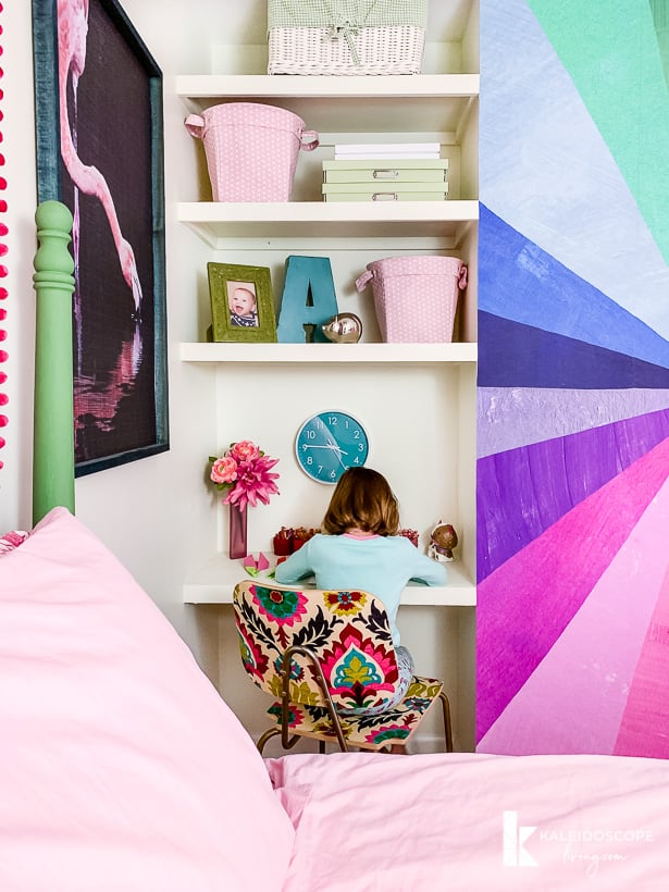 floating shelves and desk in colorful room