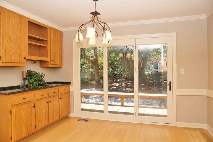 outdated kitchen with orange oak cabinets