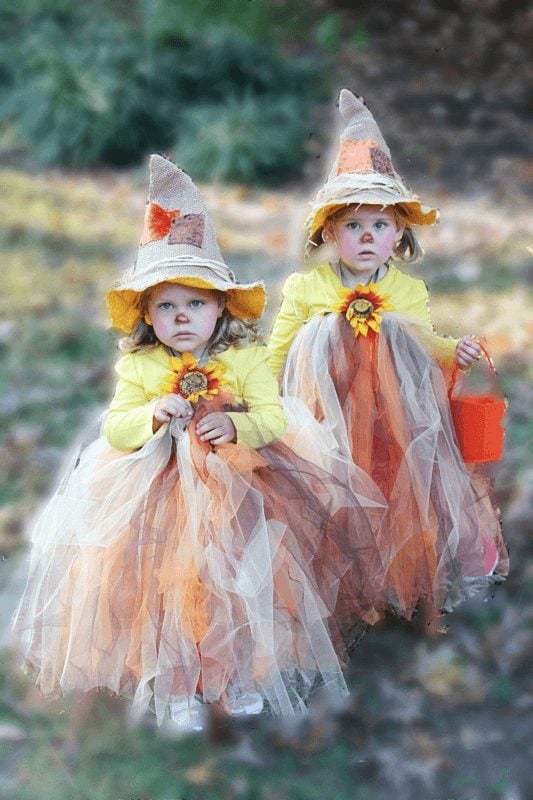 Two little girls wearing DIY scarecrow costumes