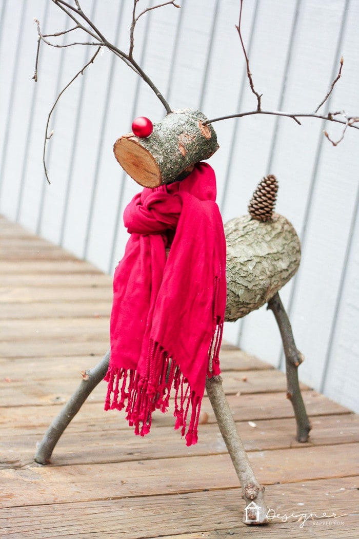 THIS IS SO CUTE! A DIY reindeer made from tree branches and logs! Check out this full tutorial on how to make a Christmas reindeer by Designer Trapped in a Lawyer's Body!