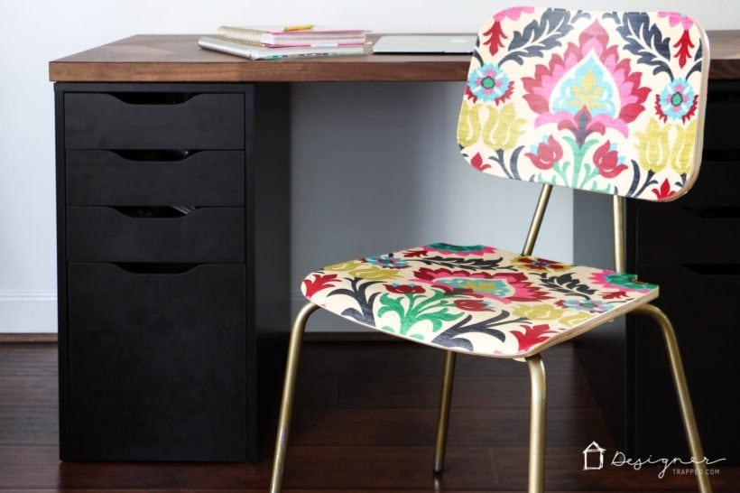 decoupaged wood chair with fabric in front of desk
