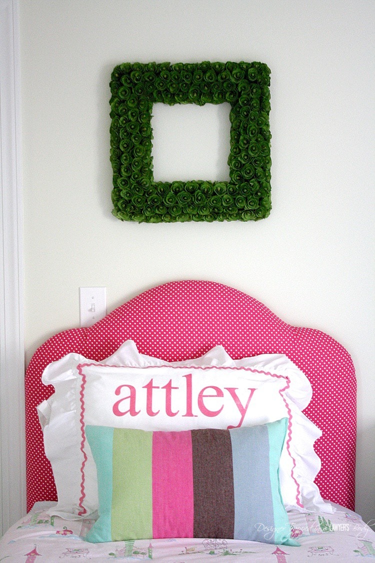 pink upholstered DIY headboard in little girl room
