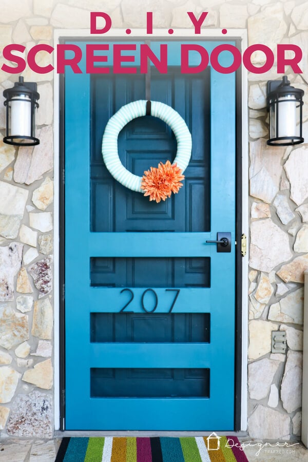 teal blue DIY screen door surrounded by stone