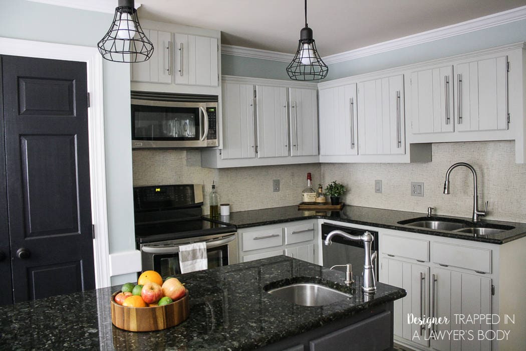 LOVE THIS! Totally genius to use Formica Laminate as a backsplash. No grout to clean. Plus, it's a fresh, modern look! Full details from Designer Trapped in a Lawyer's Blody. #homechichome #ad