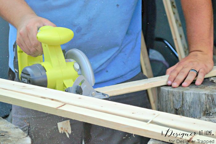 circular saw cutting reclaimed wood from a box spring A Designer At Home for Designer Trapped