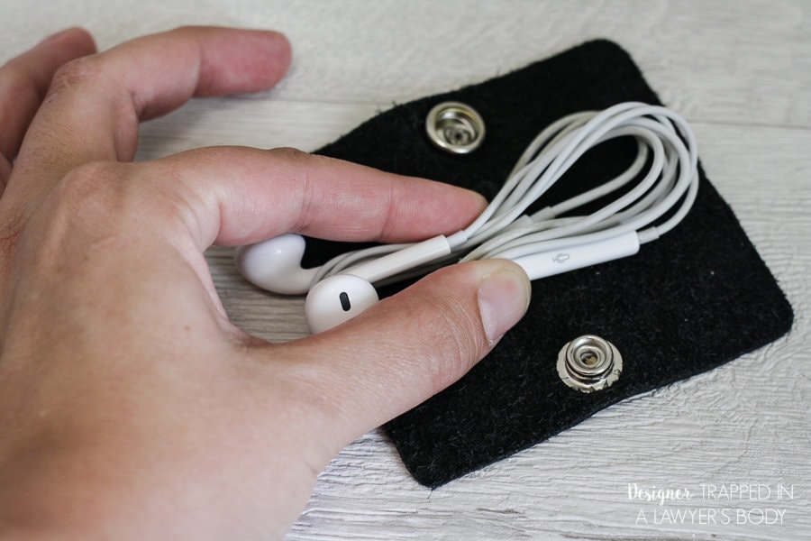 THIS IS AWESOME! An easy to make DIY earbud holder will make storing your earbuds easier than ever. Full tutorial by Designer Trapped in a Lawyer's Body.