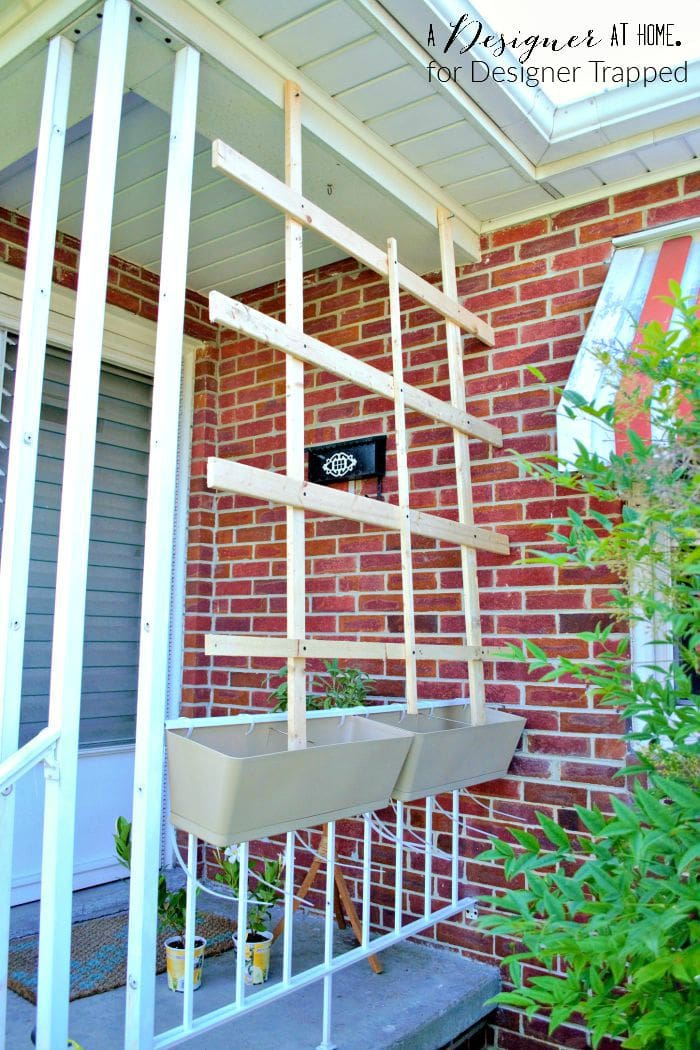 dressing up the front porch by adding window boxes to porch railing and lattice in progress A Designer At Home for Designer Trapped
