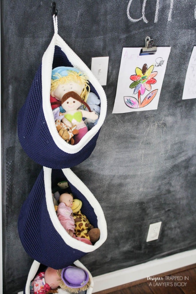 This is BRILLIANT and so easy! Use baskets for easy, DIY hanging toy storage in any kid's space! Full tutorial by Designer Trapped in a Lawyer's Body.