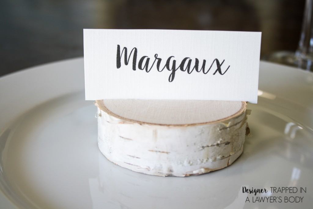 LOVE THESE! Make your own DIY place card holders using wood slices. It takes about 30 seconds per place card holder. Full tutorial from Designer Trapped in a Lawyer's Body. 