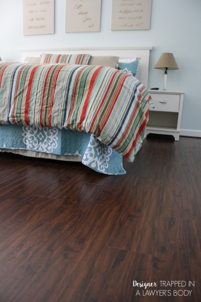 WOW! Never underestimate the power of fresh paint and new flooring! This room was totally transformed with paint and Select Surfaces laminate flooring. Come learn more at Designer Trapped in a Lawyer's Body.