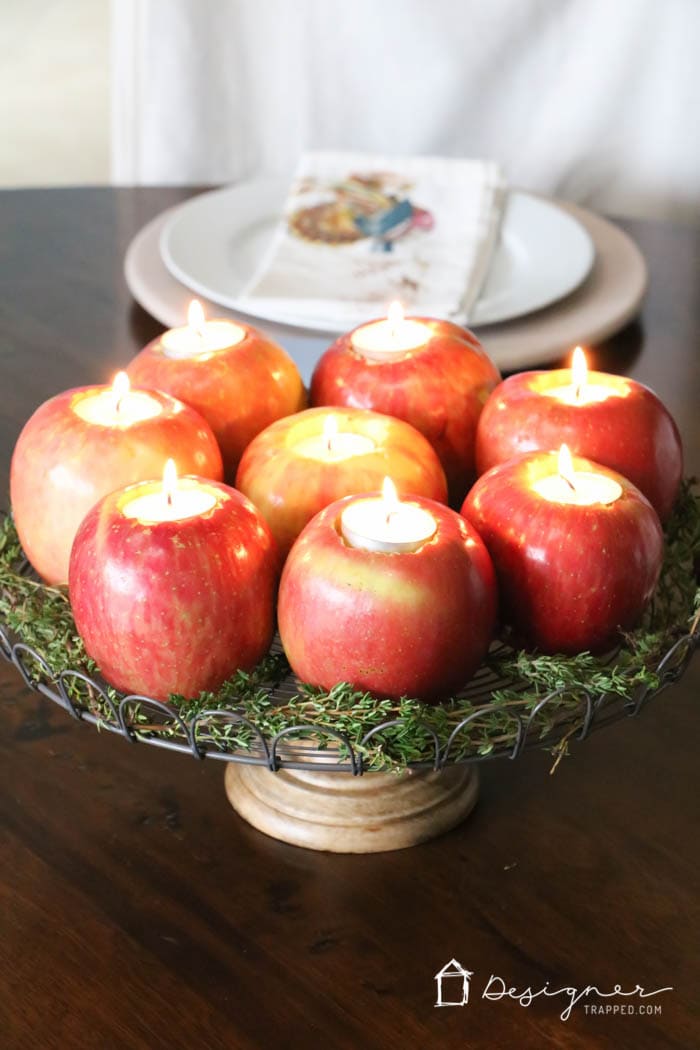 fresh apples turned into tealight candle holders in table centerpiece