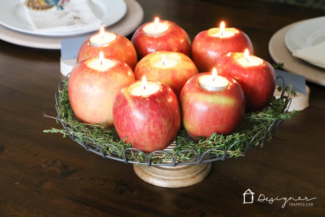 fresh apples turned into tealight candle holders in table centerpiece