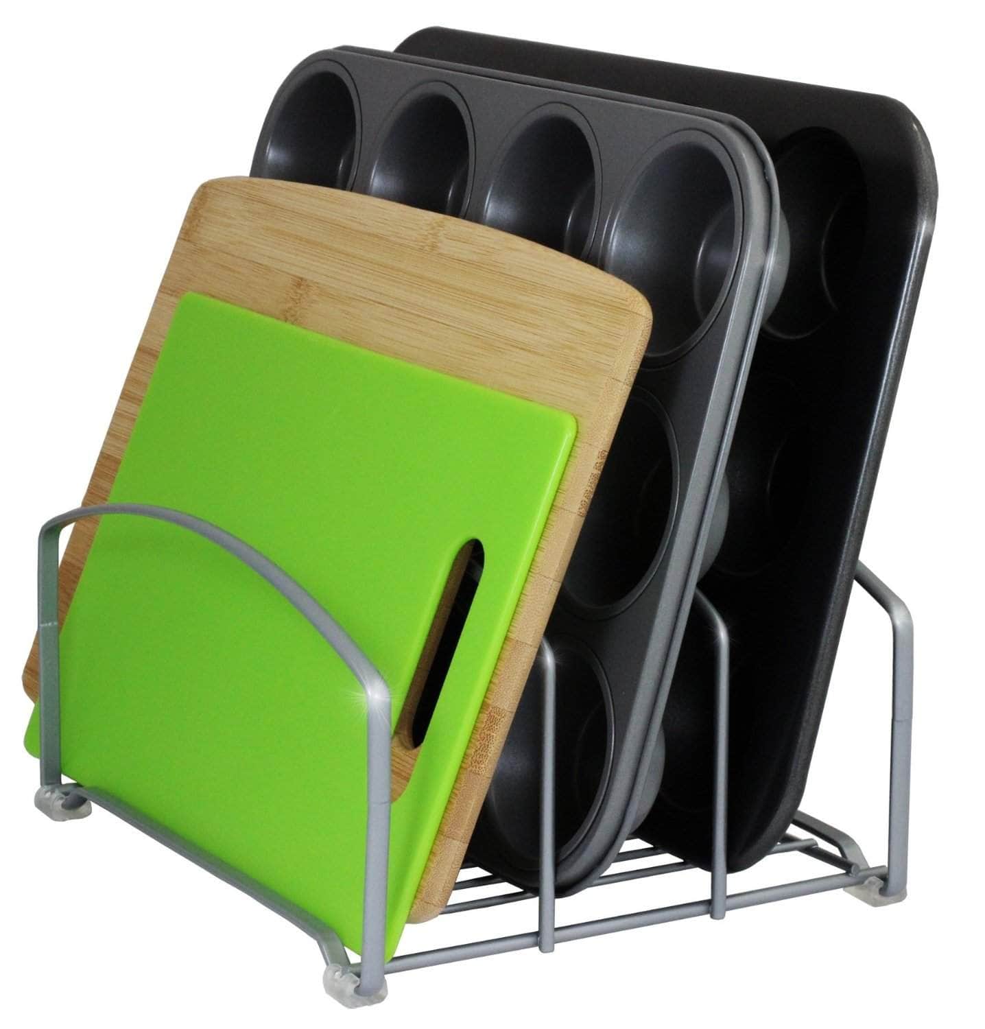 A cookie sheet and cutting board organizer holding various cutting boards and muffin tins against a white background.