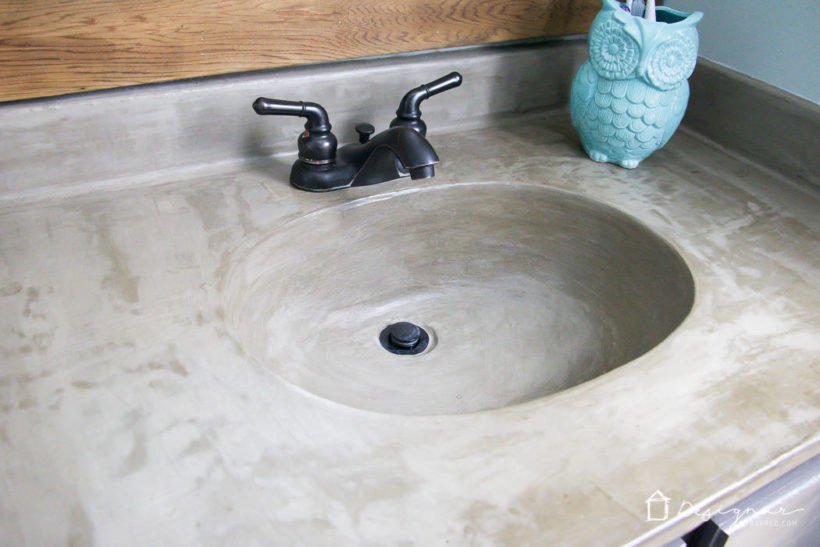 Learn how our DIY concrete vanity is holding up 18 months after completion! / DIY concrete counter top / DIY concrete sink / designertrapped.com