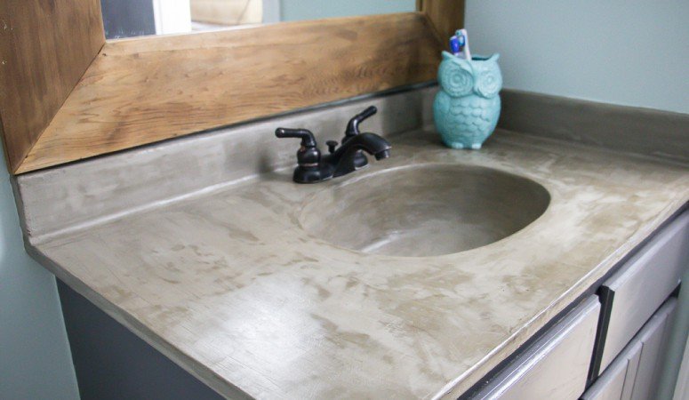 You can update your bathroom vanity without spending a fortune! This DIY vanity update using a concrete overlay with Ardex Feather Finish can be done for around $50 (including a new faucet). Check out the full tutorial!