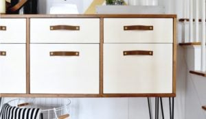 photo of modern wood and white credenza with hairpin legs and leather drawer pulls