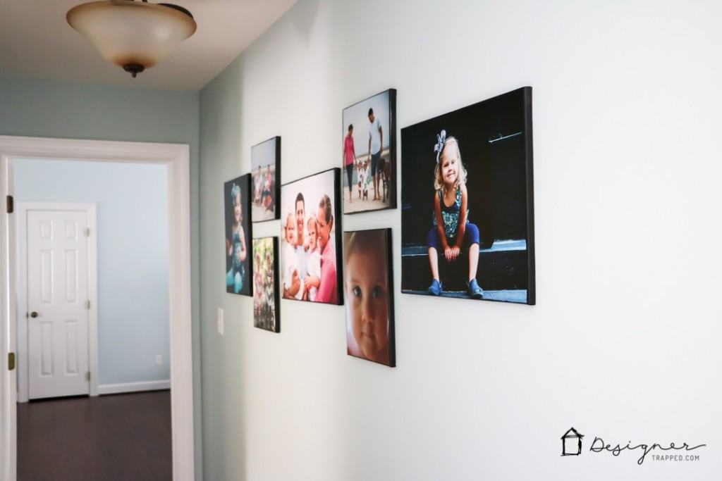 LOVE how this blogger added personality to her hallway with this gorgeous wall gallery full of family photos and special pieces! 