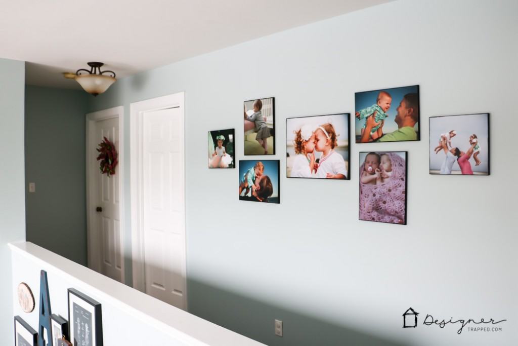 LOVE how this blogger added personality to her hallway with this gorgeous wall gallery full of family photos and special pieces! 