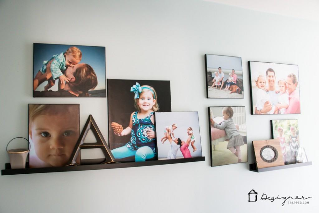 LOVE how this blogger added personality to her hallway with this gorgeous wall gallery full of family photos and special pieces!