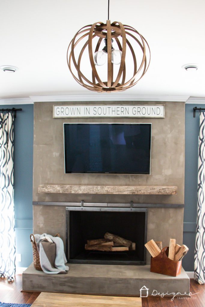 OMG, this fireplace makeover is amazing and was done on such a small budget!