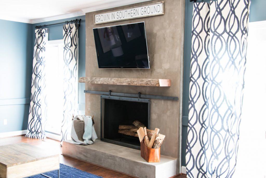 OMG, this fireplace makeover is amazing and was done on such a small budget!