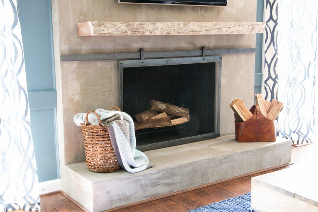 OMG, this fireplace makeover is amazing and was done on such a small budget!