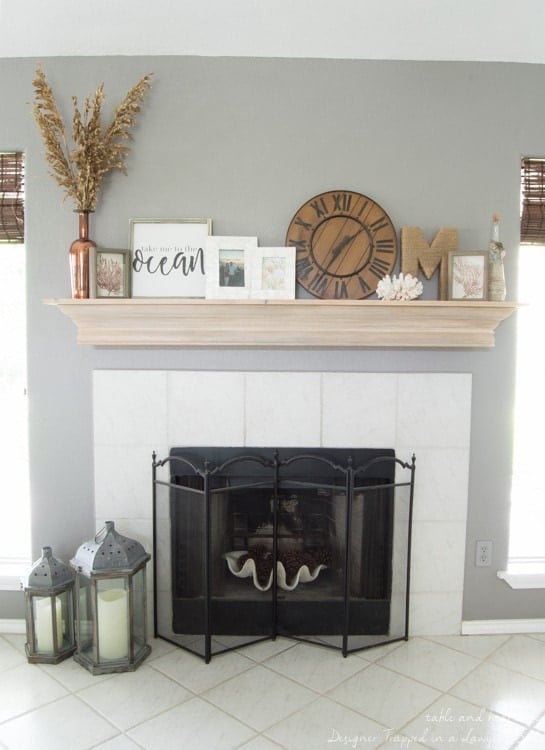 Wow! Check out this DIY fireplace mantel update made from simple molding. Love the driftwood finish! 