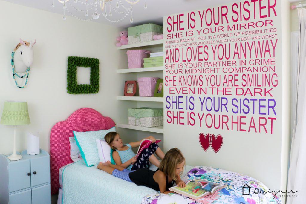 diy vinyl wall quote about sisters on wall in girl's bedroom