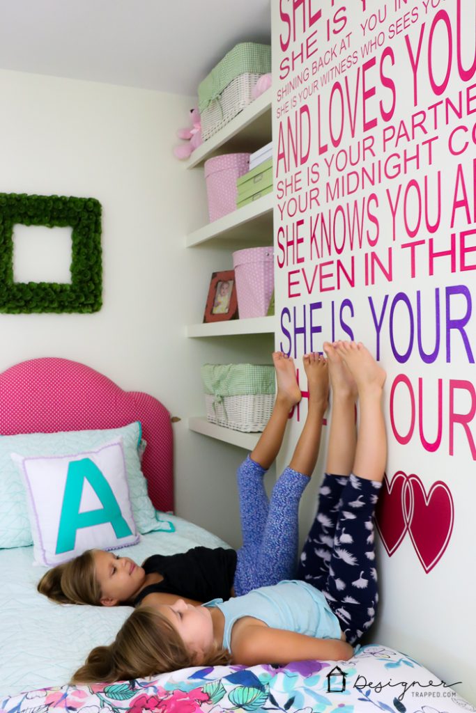large vinyl wall quote about sisters on wall in girl's bedroom