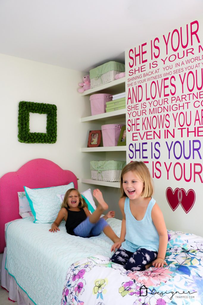 vinyl wall quote about sisters on wall in girl's bedroom