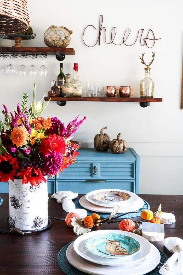 colorful dining room with pipe shelves