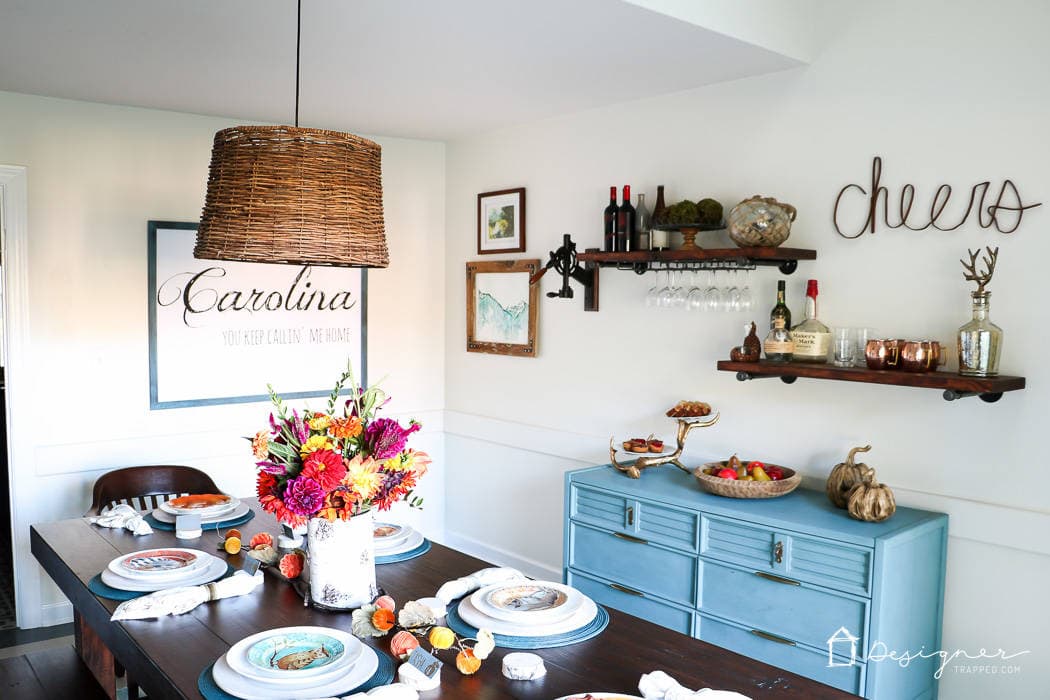 colorful dining room with pipe shelves