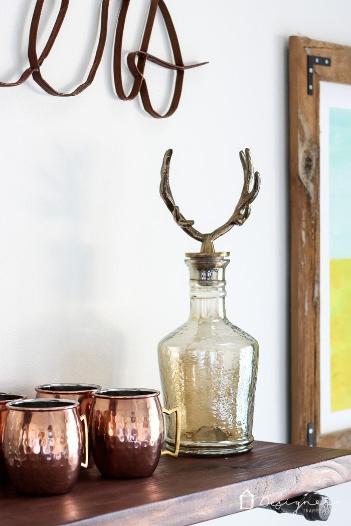 pipe shelves with copper mugs