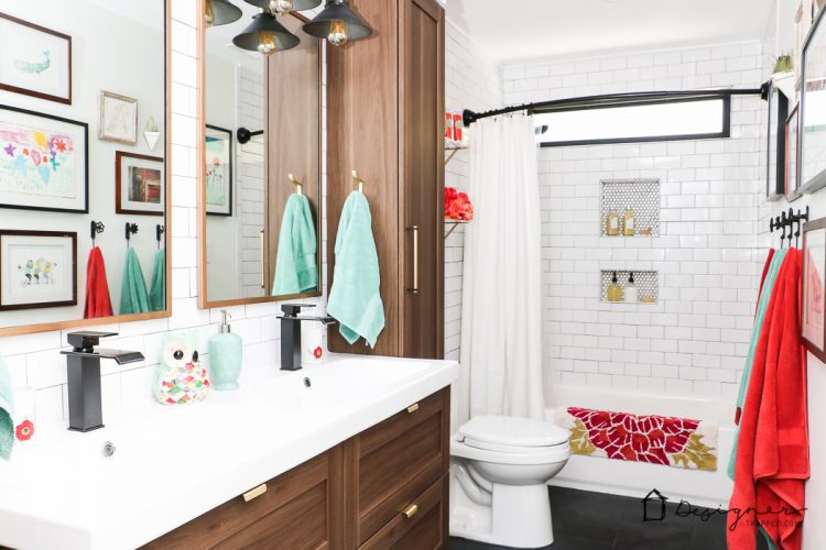 WOW, WOW, WOW! This DIY bathroom remodel is by far one of the best I have seen, and they REALLY did all the work themselves! I love the floor to ceiling subway tile, the black slate tile floor and the penny tile accents. And that floating vanity is amazing. 