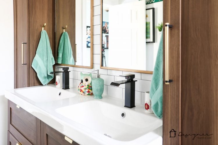 WOW, WOW, WOW! This DIY bathroom remodel is by far one of the best I have seen, and they REALLY did all the work themselves! I love the floor to ceiling subway tile, the black slate tile floor and the penny tile accents. And that floating vanity is amazing. 