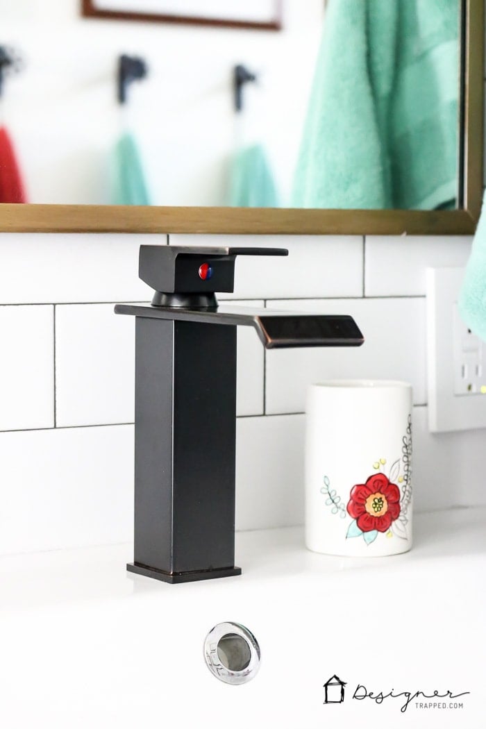 WOW, WOW, WOW! This DIY bathroom remodel is by far one of the best I have seen, and they REALLY did all the work themselves! I love the floor to ceiling subway tile, the black slate tile floor and the penny tile accents. And that floating vanity is amazing. 