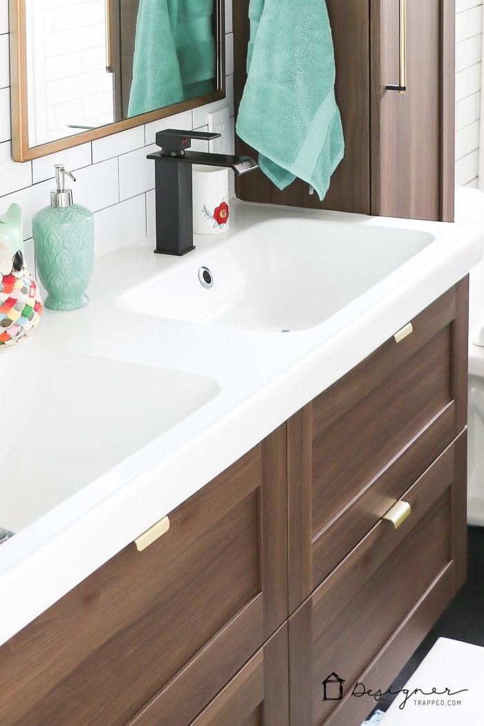 WOW, WOW, WOW! This DIY bathroom remodel is by far one of the best I have seen, and they REALLY did all the work themselves! I love the floor to ceiling subway tile, the black slate tile floor and the penny tile accents. And that floating vanity is amazing.