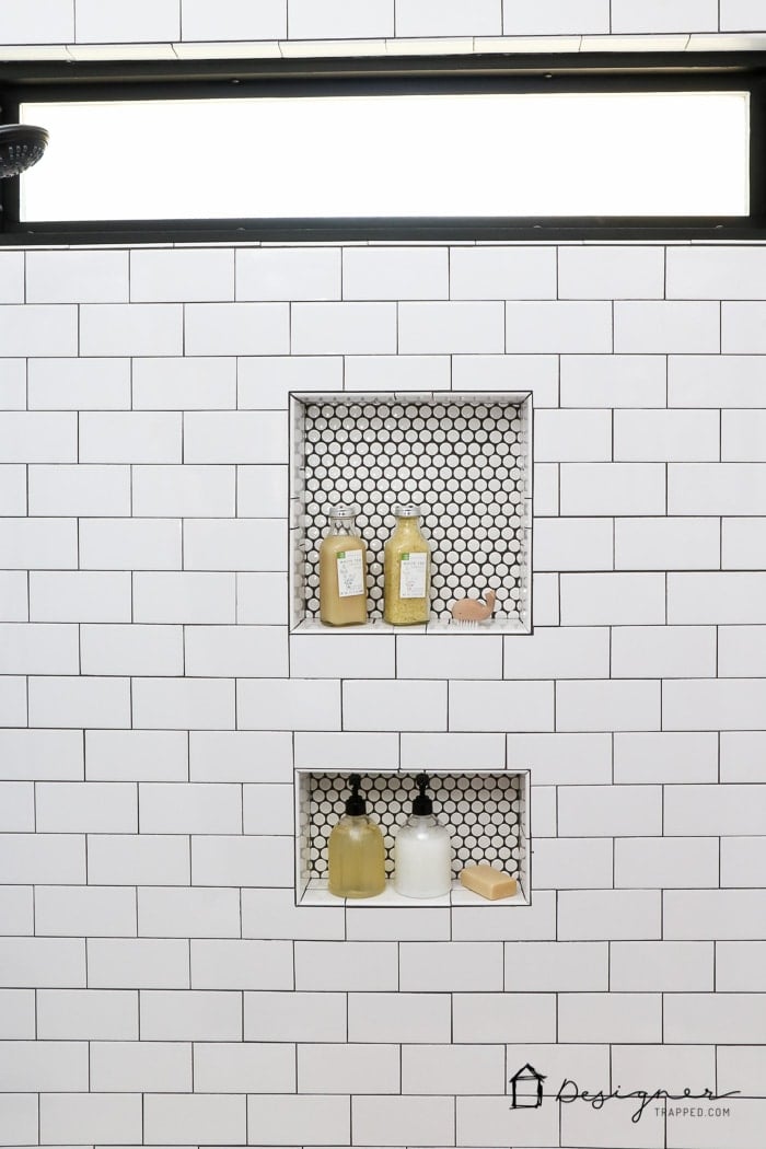 WOW, WOW, WOW! This DIY bathroom remodel is by far one of the best I have seen, and they REALLY did all the work themselves! I love the floor to ceiling subway tile, the black slate tile floor and the penny tile accents. And that floating vanity is amazing. 