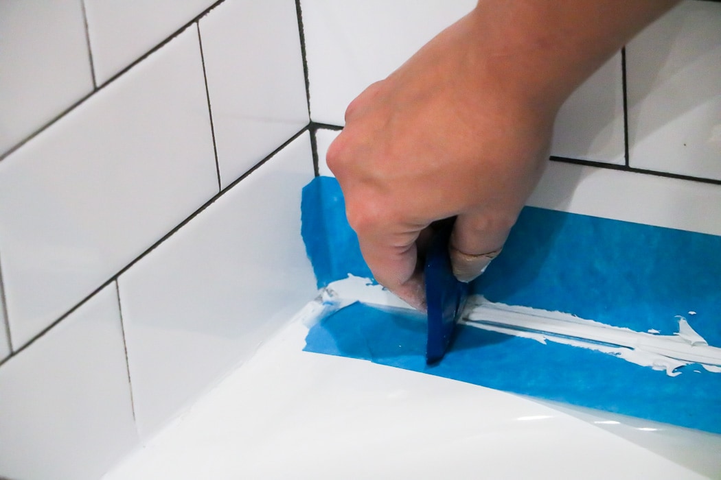 These instructions for how to caulk a bathtub are super easy to follow and will give you a perfectly straight and tidy caulk line, just like the pros. If you need to know how to caulk a bathtub, READ this first! This blogger tells you what you SHOULD and SHOULD NOT do!