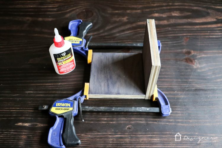 Make these DIY bookends for a high-style look on a tiny budget yourself! It's a fun and easy project. No power tools required! Check out the full blog post to see how I made these DIY bookends for $1 out of pocket!