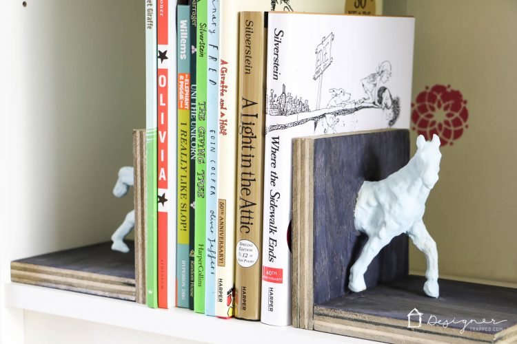Make these DIY bookends for a high-style look on a tiny budget yourself! It's a fun and easy project. No power tools required! Check out the full blog post to see how I made these DIY bookends for $1 out of pocket!