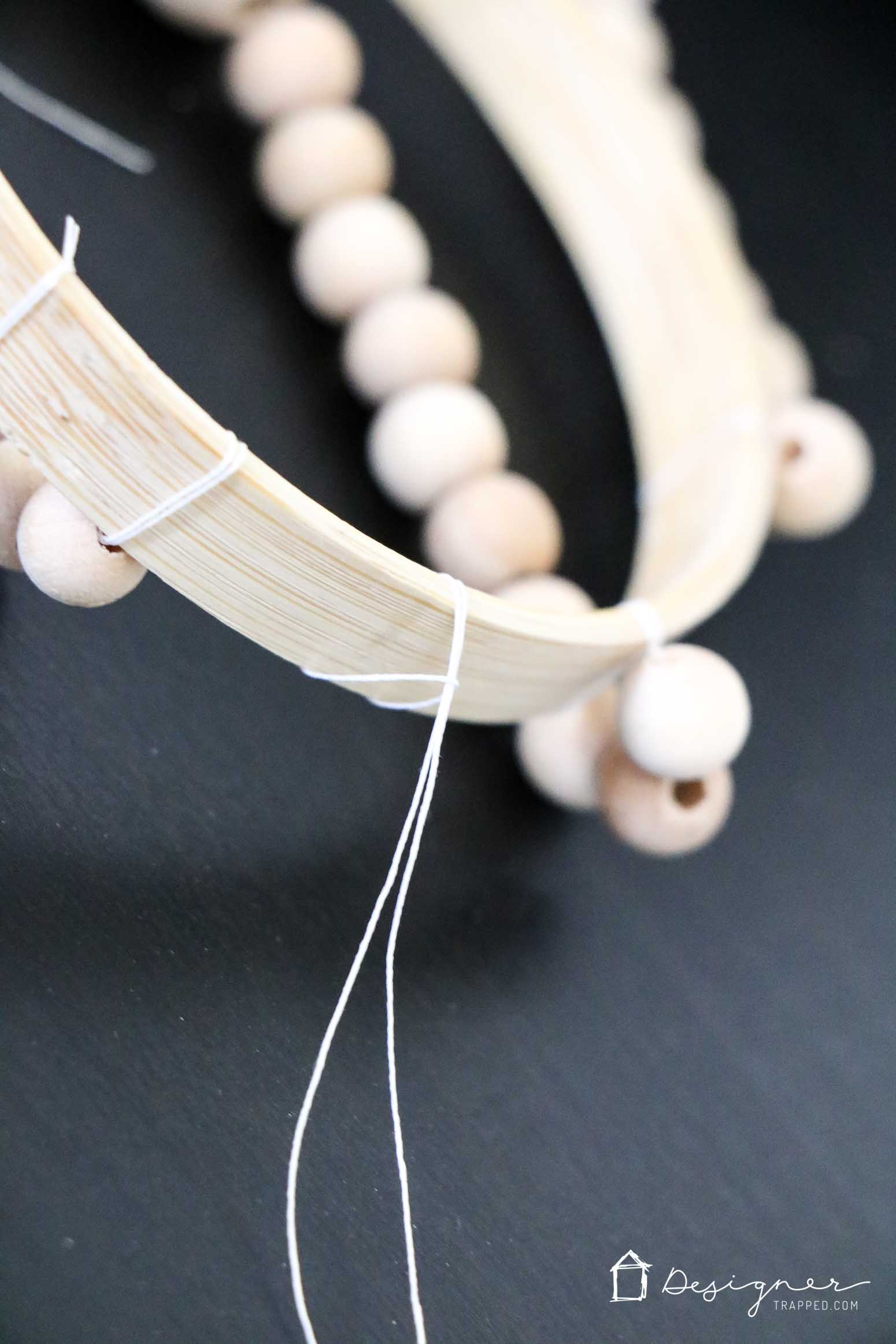 diy chandelier from wood beads being assembled