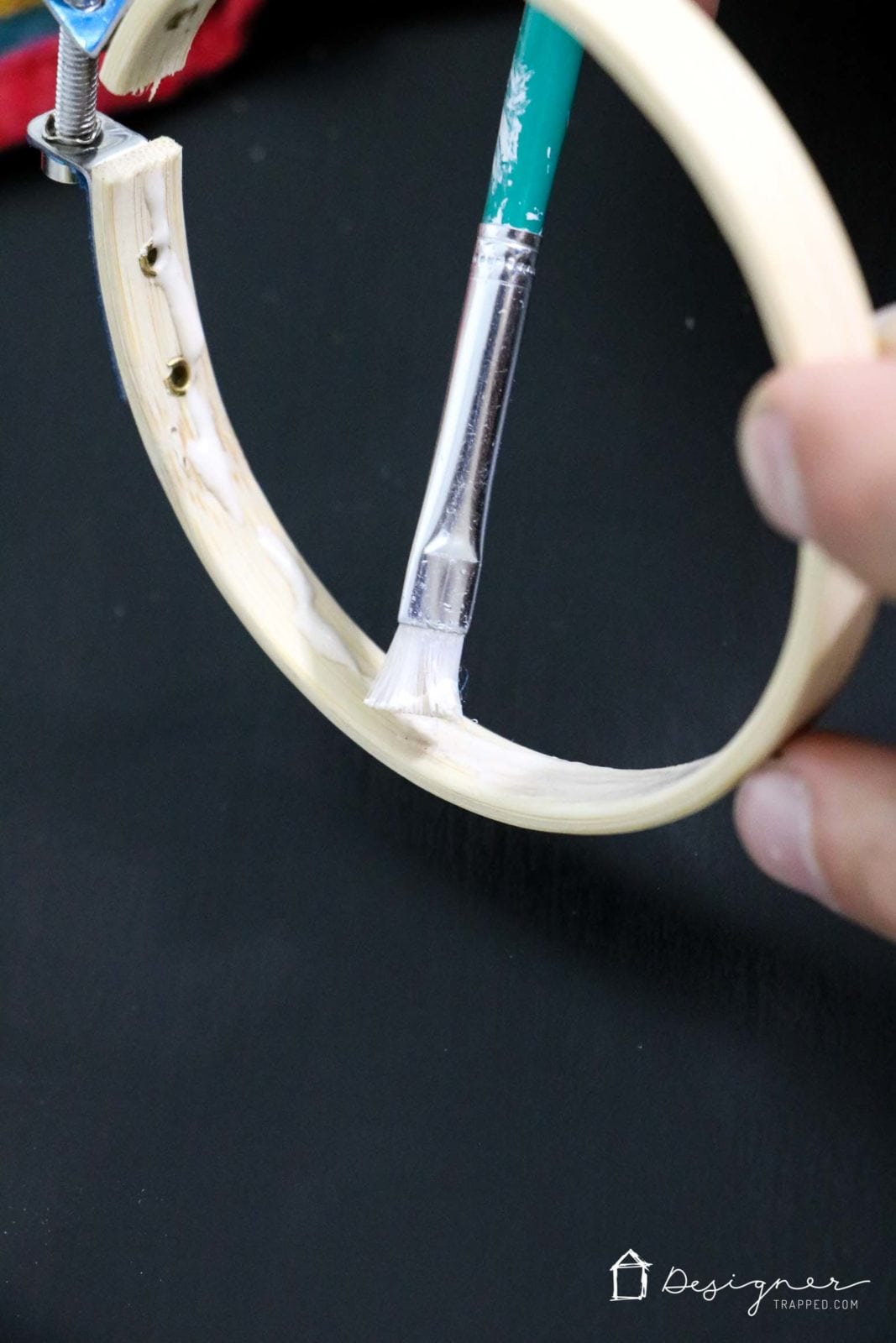 gluing outer quilting hoop during diy chandelier assembly