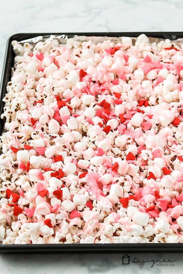 OMG! Love this pretty and super easy pink popcorn for Valentine's Day. It looks like a kid-friendly recipe that my girls will love making and they can even share it with their friends as a Valentine's Day treat to go with their Valentine's Day cards at school! 