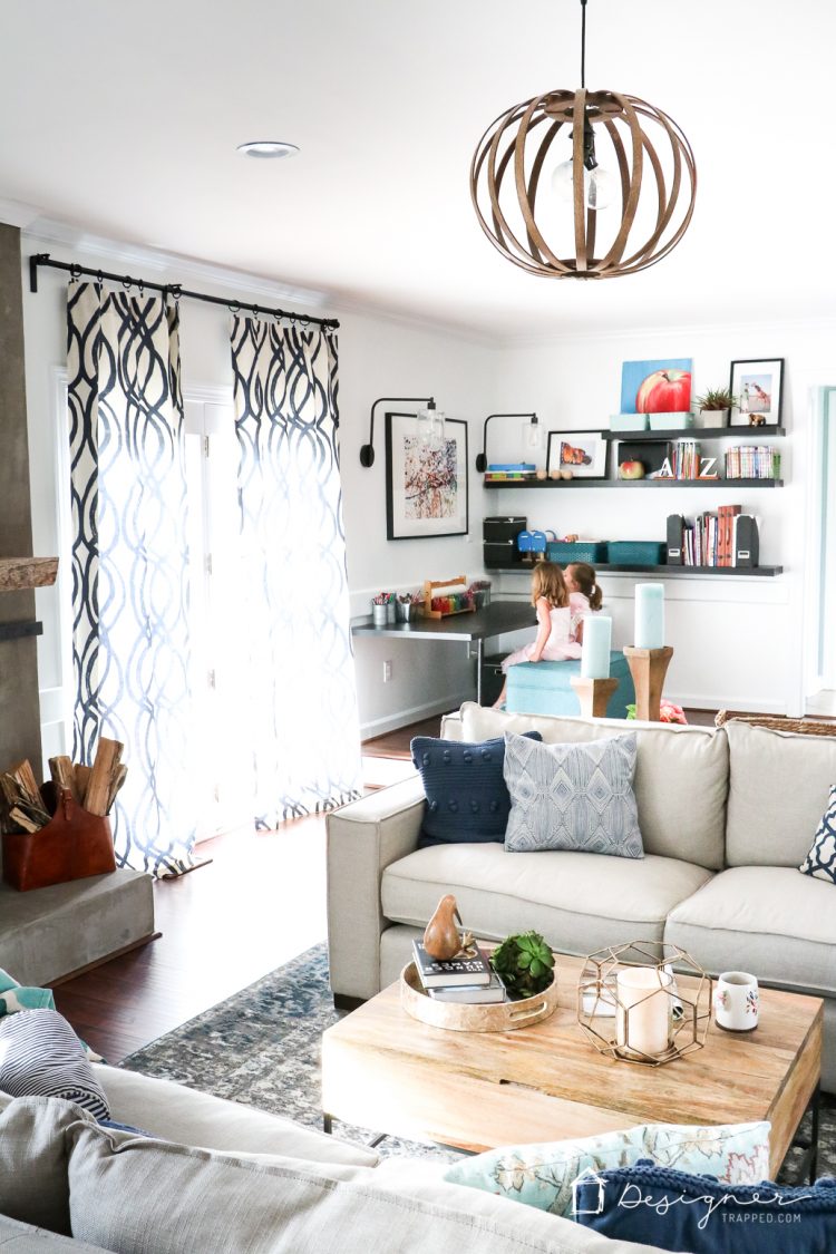LOVE this family room design! Such a great way to combine a playroom and family room the whole family can enjoy into one space. Super smart design choices! #spon