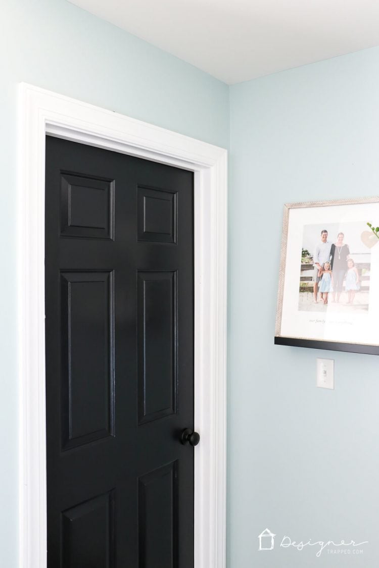 Love the idea of painting interior doors black for an affordable interior update! All you have to do is paint your doors black and update the hardware. HUGE impact!