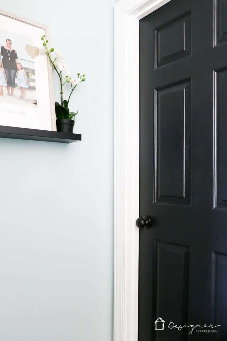 Love the idea of painting interior doors black for an affordable interior update! All you have to do is paint your doors black and update the hardware. HUGE impact!