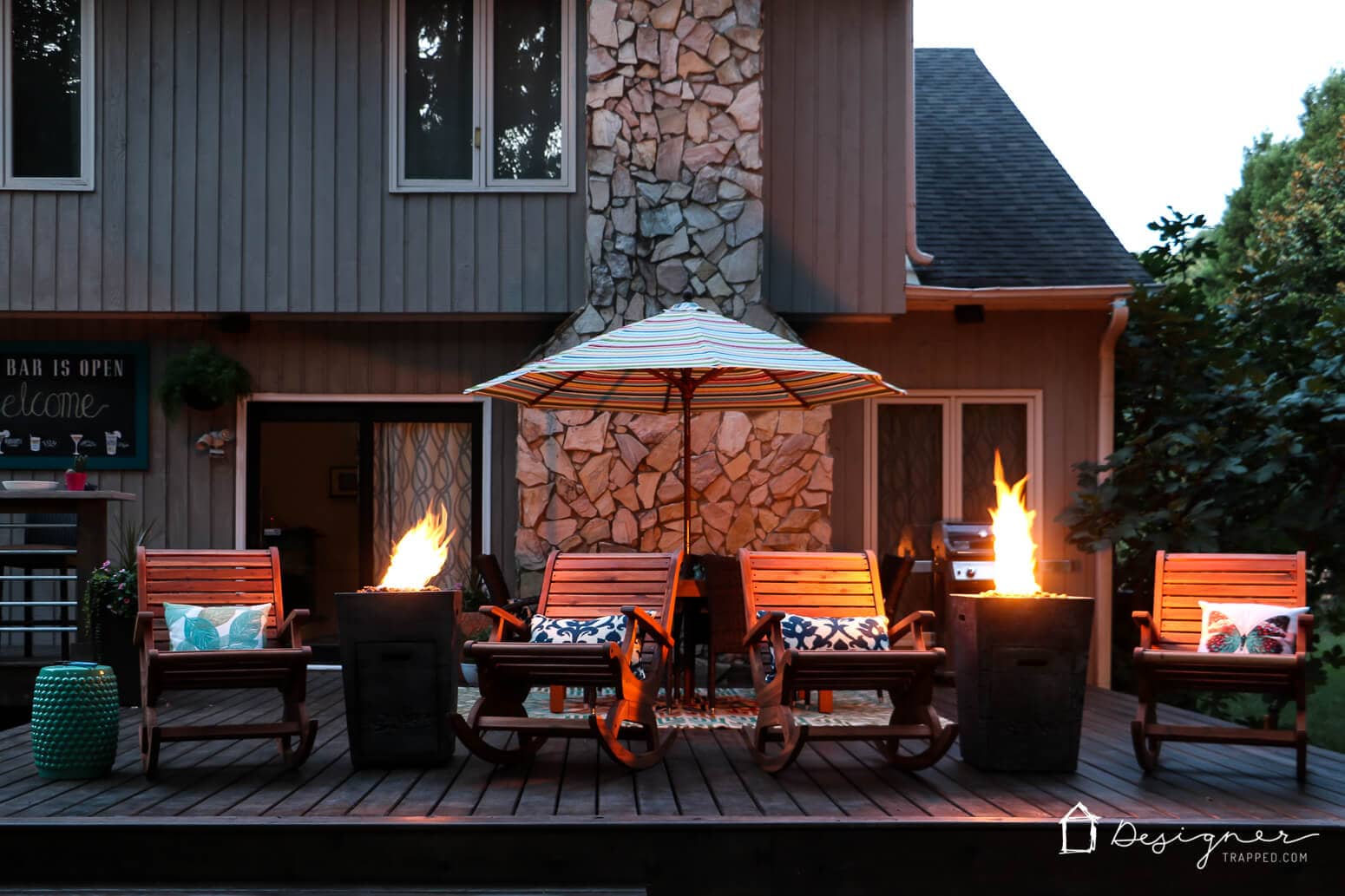 back deck with teak rockers and fire columns